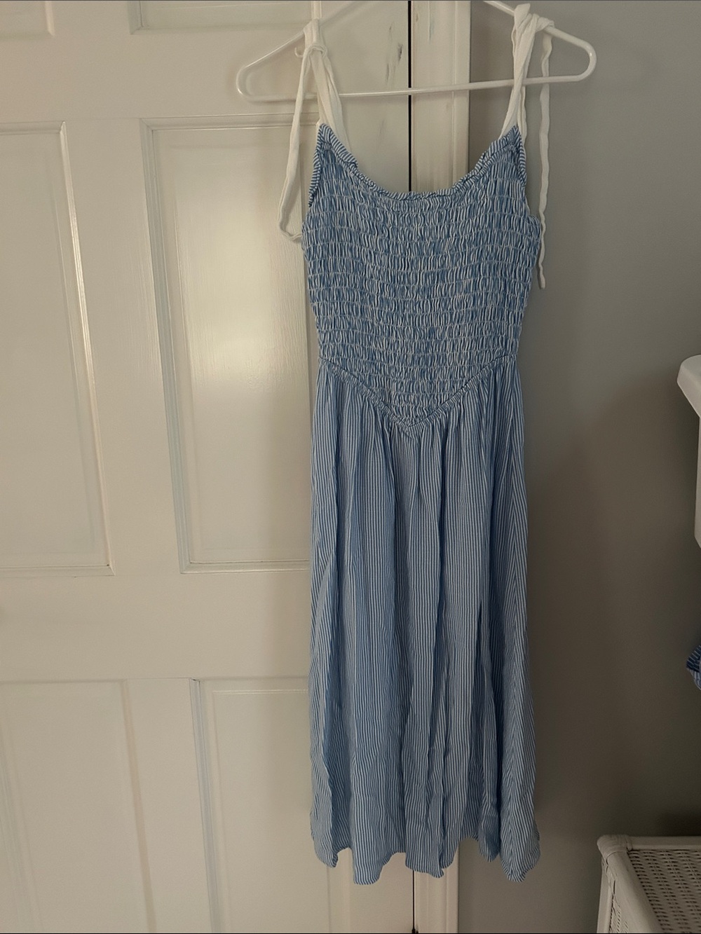 Light Blue Striped Smocked Sundress with White Tie straps.